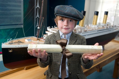 Master Reuben with a model of the Titanic in the Titanic Experience. (Photo: Gerard McCarthy, Thanks to Titanic Experience Cobh)
